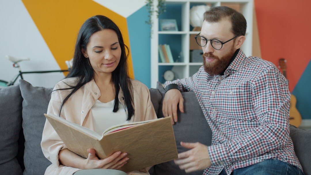 person reading book at home
