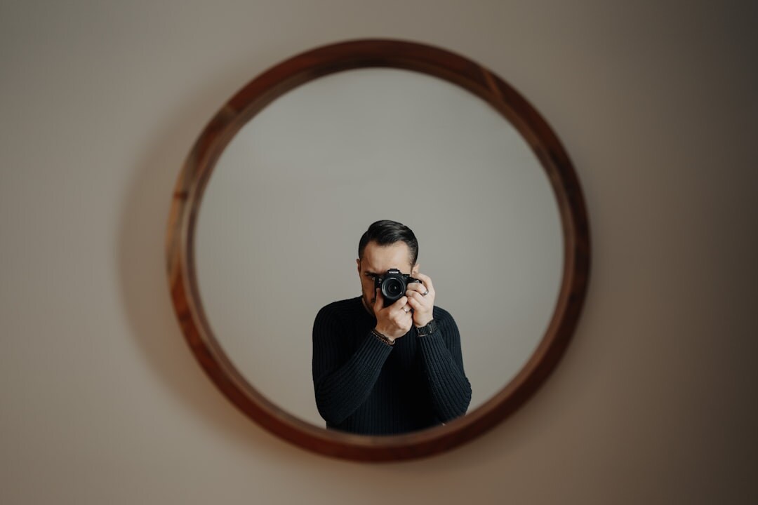 person reflecting in mirror